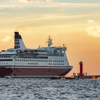 Red cruise liner. Passenger ferry sailing from Riga to Stockholm