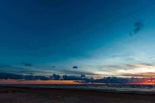 Blue cloudy sky over the Baltic sea at evening