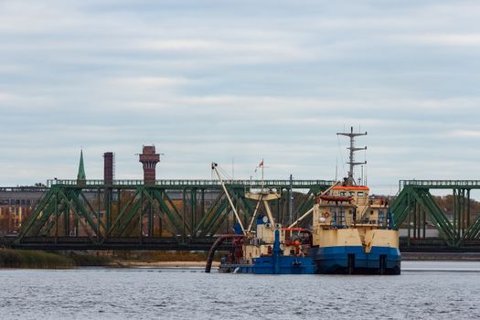 Blue cargo ship in the port of Riga, Europe
