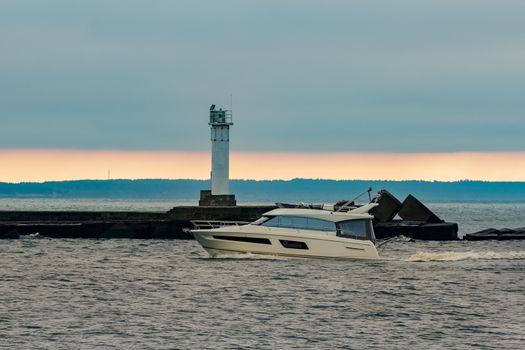 White small speed boat sailing in still water