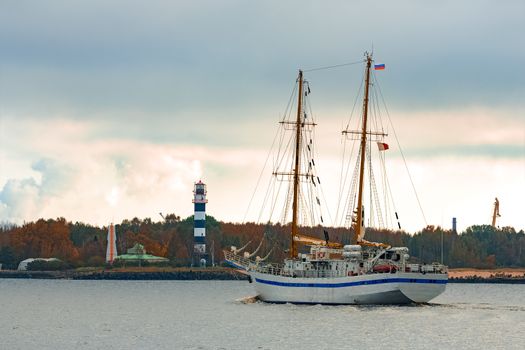 White sailing ship coming from Baltic sea and entering Riga