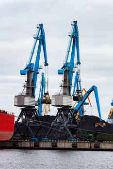 Blue cargo cranes in the port of Riga, Europe