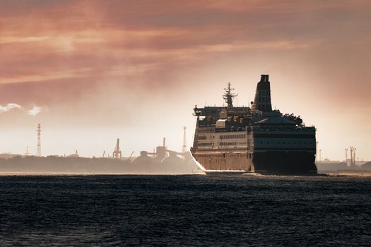 Big cruise liner. Passenger ferry ship entering Riga at morning