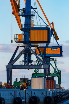 Yellow cargo cranes in the port of Riga, Europe