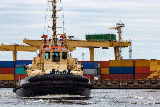 Tug ship in the cargo port of Riga, Europe