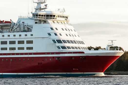 Red cruise liner's bow. Passenger ferry underway close up