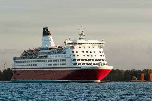Red cruise liner. Passenger ferry sailing from Riga to Stockholm