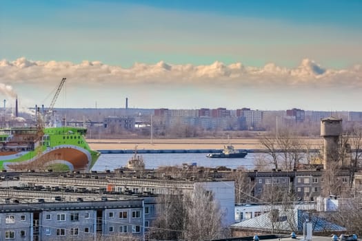 Green cruise liner. Passenger ferry sailing past the Riga city