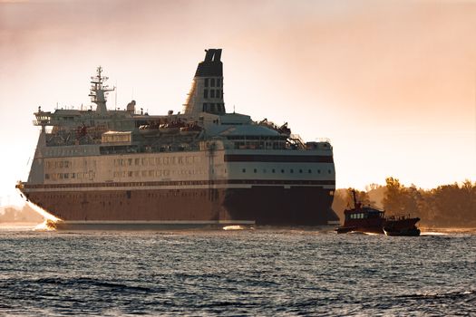 Big cruise liner. Passenger ferry ship entering Riga at morning