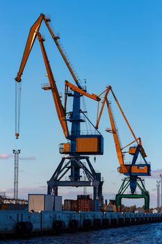 Yellow cargo cranes in the port of Riga, Europe