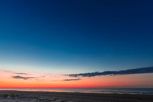 Blue cloudy sky over the Baltic sea at evening