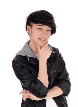 A closeup portrait image of a young Korean man with his hand on
his chin, smiling, isolated for white background.
