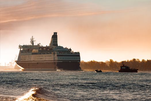 Big cruise liner. Passenger ferry ship entering Riga at morning