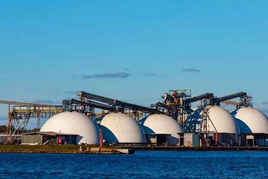 Fertilizer terminal in Riga, big white storage tanks