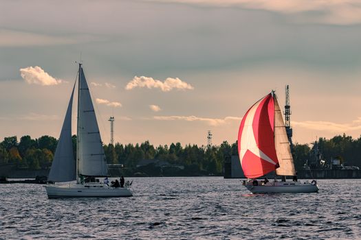 Sailboat regatta on Daugava river. Yachts sailing in Riga