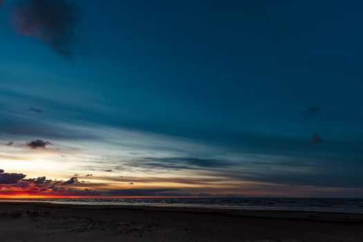 Blue cloudy sky over the Baltic sea at evening