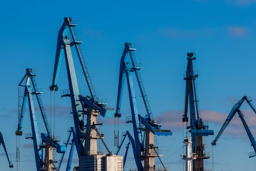 Blue cargo cranes in the port of Riga, Europe