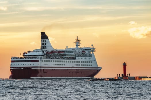 Red cruise liner. Passenger ferry sailing from Riga to Stockholm