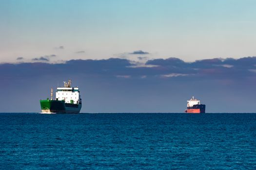 Cargo ships far in still water of Baltic sea