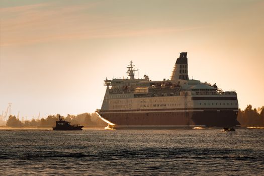 Big cruise liner. Passenger ferry ship entering Riga at morning