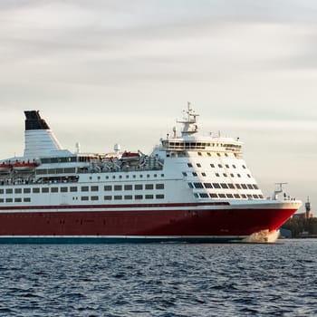 Red cruise liner. Passenger ferry sailing from Riga to Stockholm