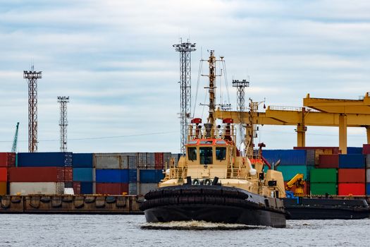 Tug ship in the cargo port of Riga, Europe