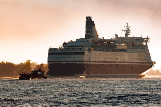 Big cruise liner. Passenger ferry ship entering Riga at morning