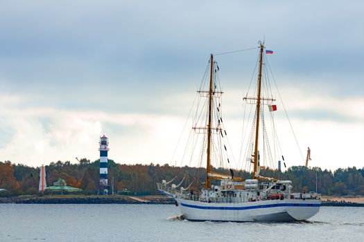 White sailing ship coming from Baltic sea and entering Riga