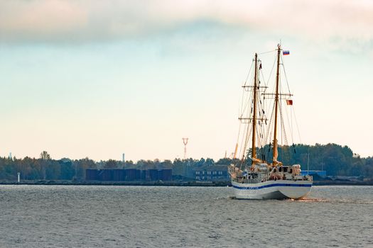 White sailing ship coming from Baltic sea and entering Riga