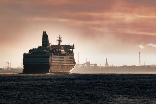 Big cruise liner. Passenger ferry ship entering Riga at morning