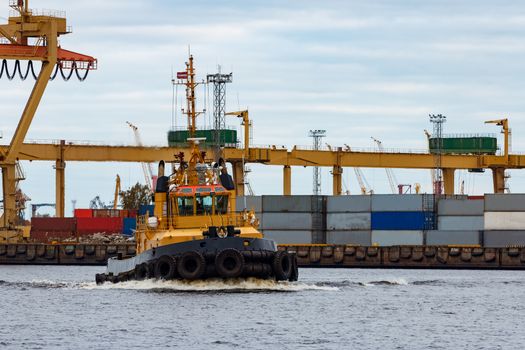 Tug ship in the cargo port of Riga, Europe