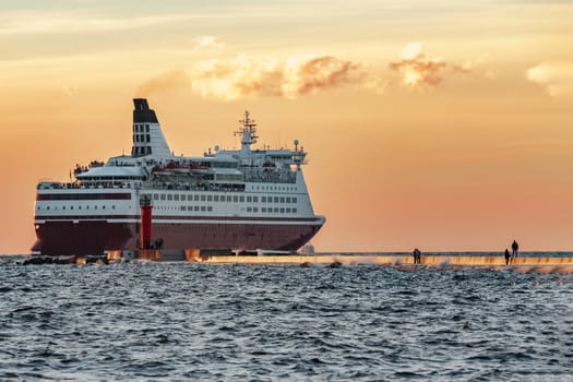 Red cruise liner. Passenger ferry sailing from Riga to Stockholm