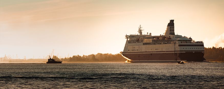 Big cruise liner. Passenger ferry ship entering Riga at morning