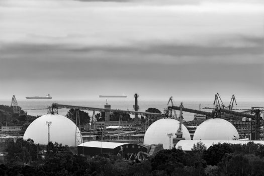 Fuel terminal in Riga, Latvia. Large oil tanks. Monochrome