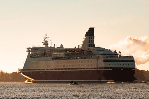 Big cruise liner. Passenger ferry ship entering Riga at morning