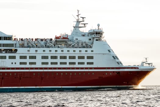 Red cruise liner's bow. Passenger ferry underway