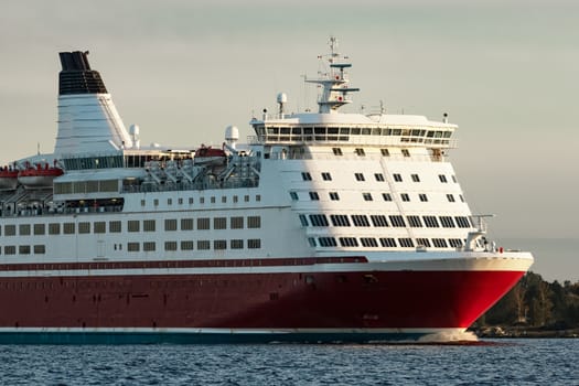 Red cruise liner's bow. Passenger ferry underway