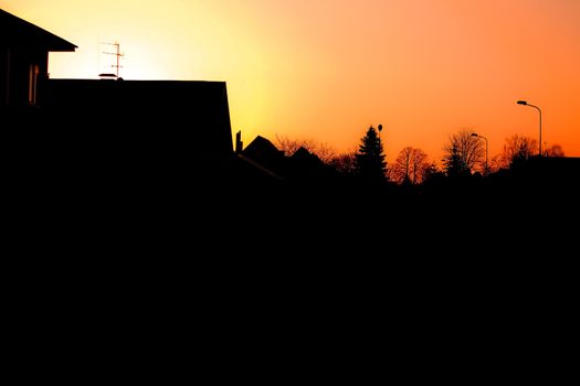 Evening townscape silhouette against the sunset sky