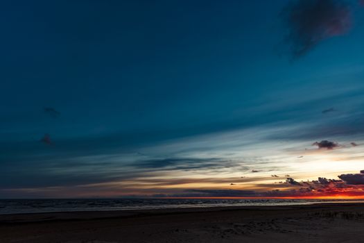 Blue cloudy sky over the Baltic sea at evening