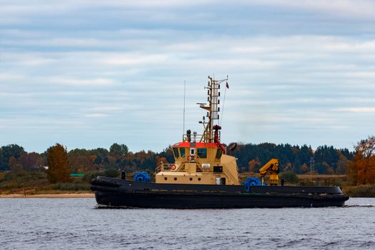 Tug ship in the cargo port of Riga, Europe