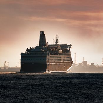 Big cruise liner. Passenger ferry ship entering Riga at morning