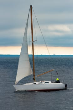 White sailboat traveling in Baltic sea