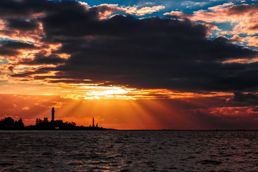 Golden sunset sky over the town silhouette