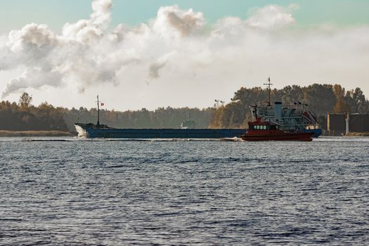 Blue cargo ship entering the port of Riga, Europe