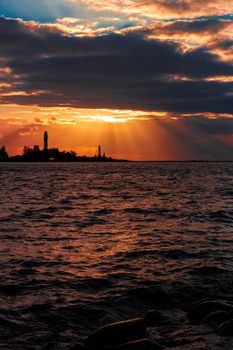 Golden sunset sky over the town silhouette