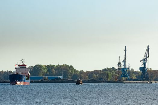 Blue cargo ship leaving the port of Riga