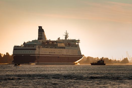 Big cruise liner. Passenger ferry ship entering Riga at morning