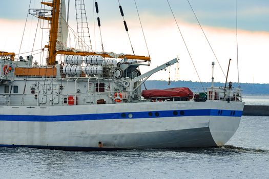 White sailing ship coming from Baltic sea and entering Riga