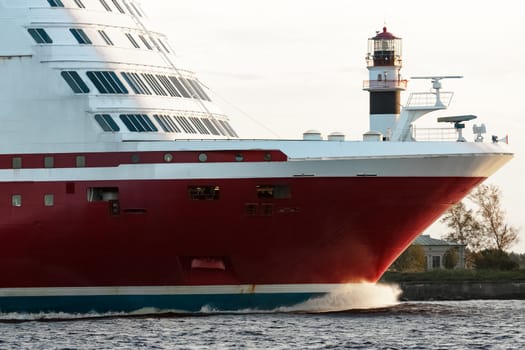 Red cruise liner's bow. Passenger ferry underway close up