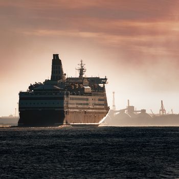 Big cruise liner. Passenger ferry ship entering Riga at morning